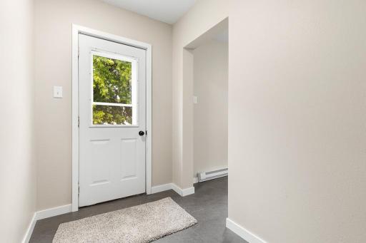 Rear entry in the laundry room and access to the kitchen