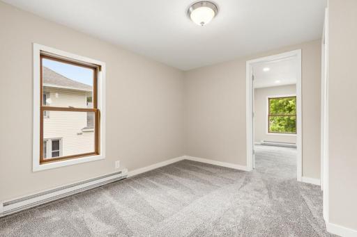 Hallway/transition room between upper level landing and primary bedroom
