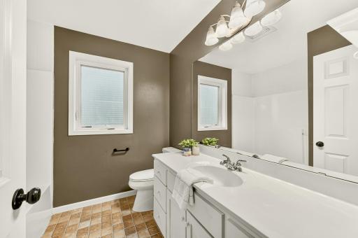 2nd bath on upper is full with a tub and large vanity