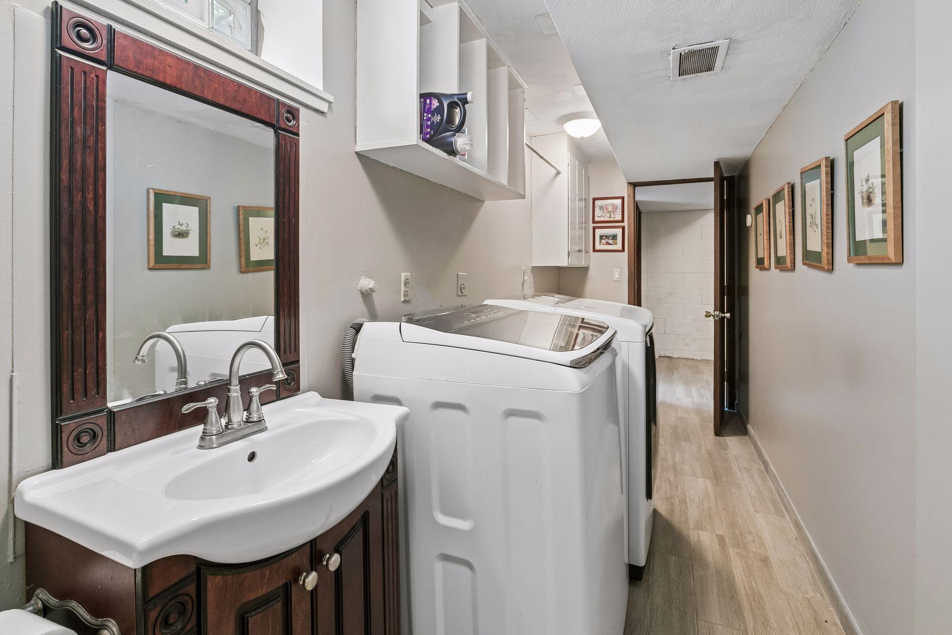 The lower level half bath and laundry room.