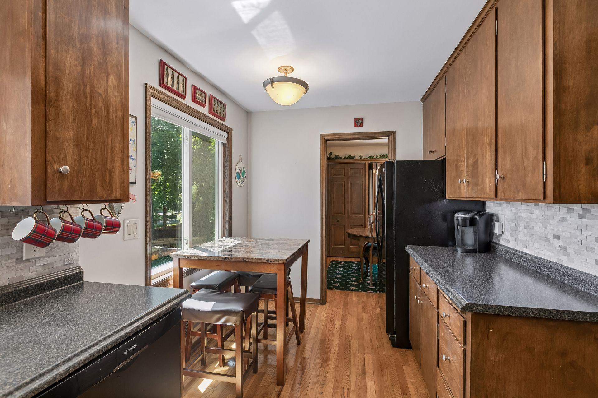 Another look at the kitchen. Tons of cabinet space and a lovely eat-in area.