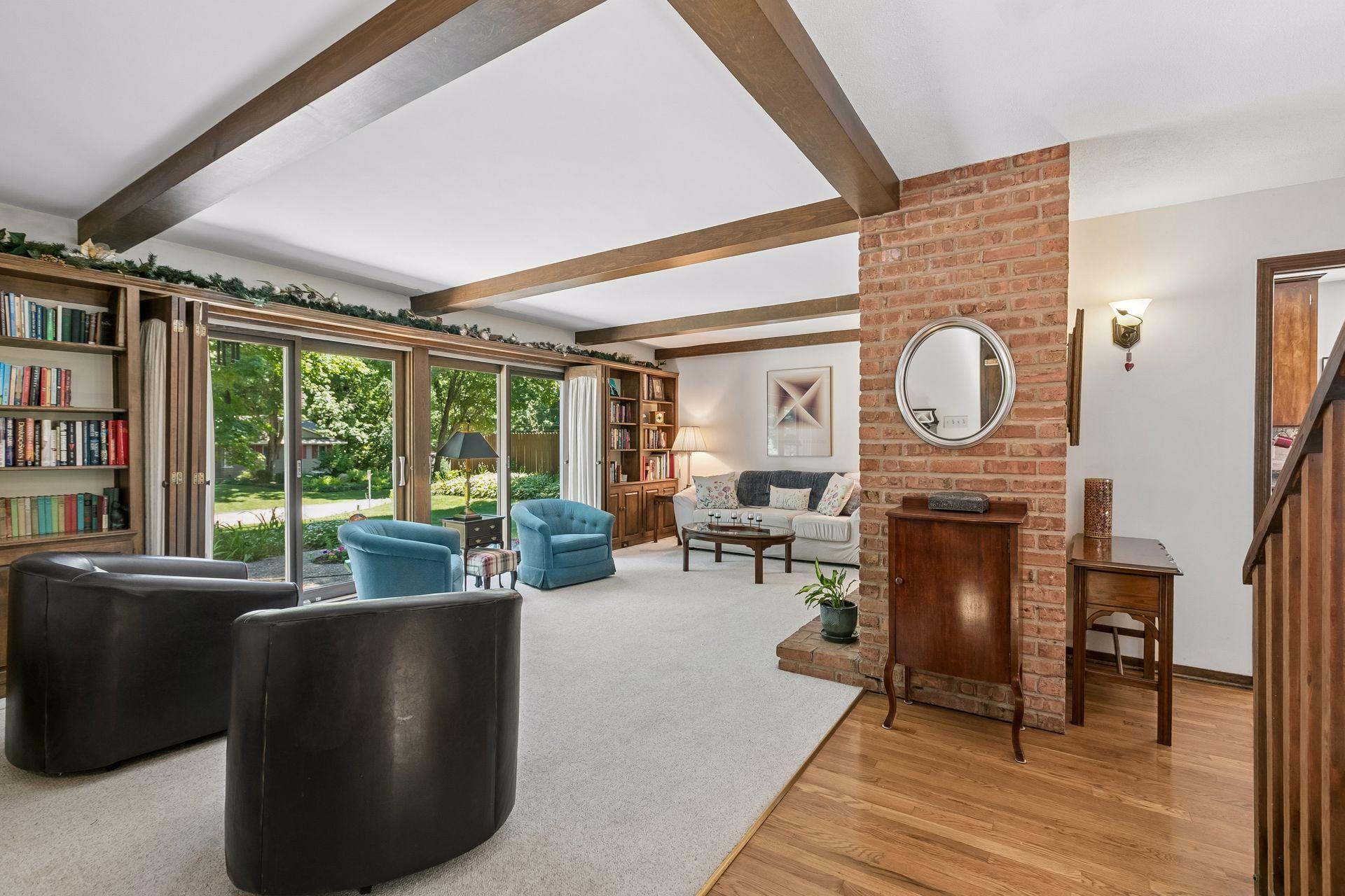 Bright and sunny spaces with walls of glass and decorative beams.
