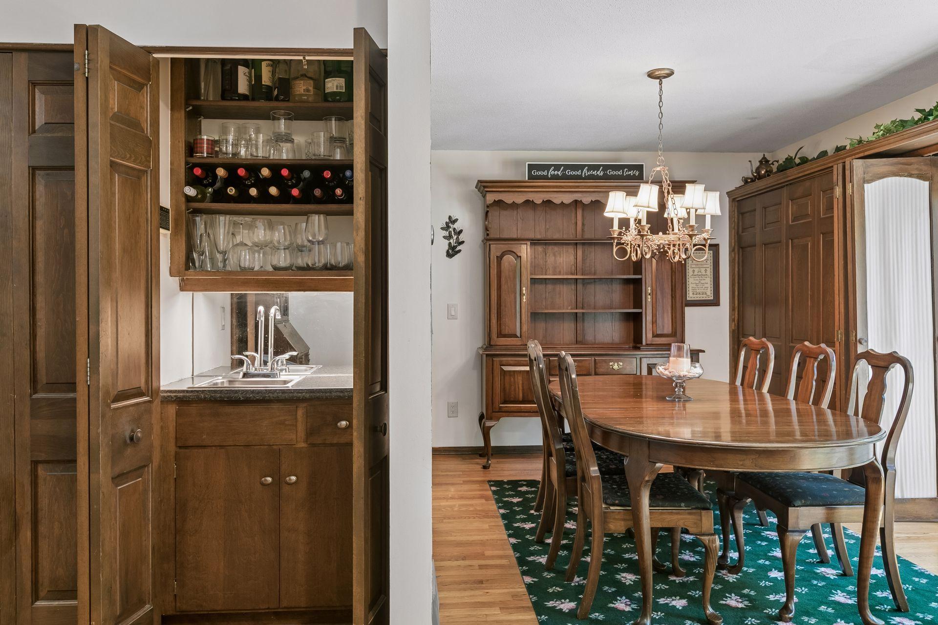 The home has a great flow for entertaining, with walls of sliding glass doors opening to both the front and backyards. There's even this fun wet bar.