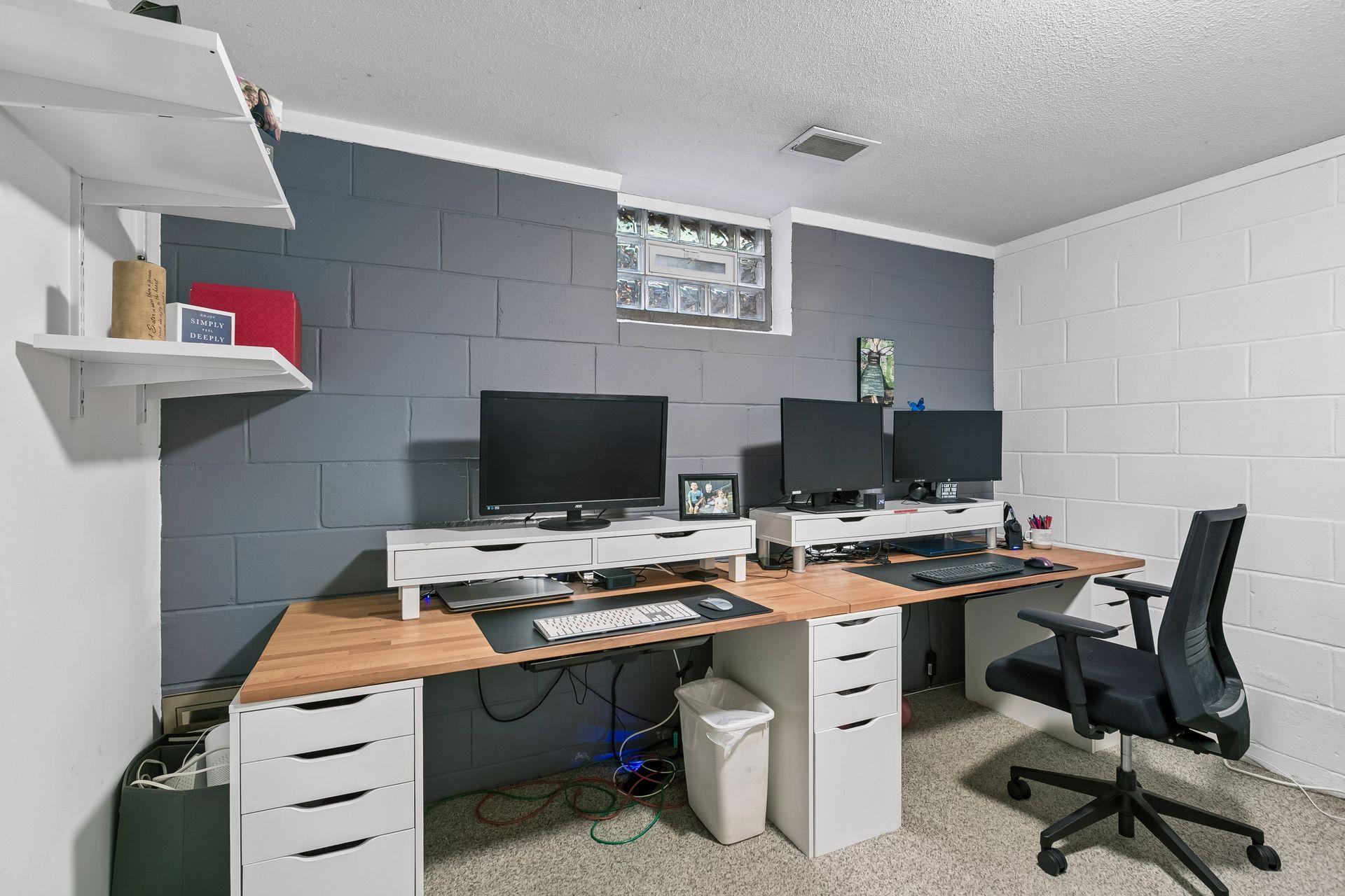 This lower level space is used as an office by the current owners, but could be a 4th bedroom with the addition of an egress window.