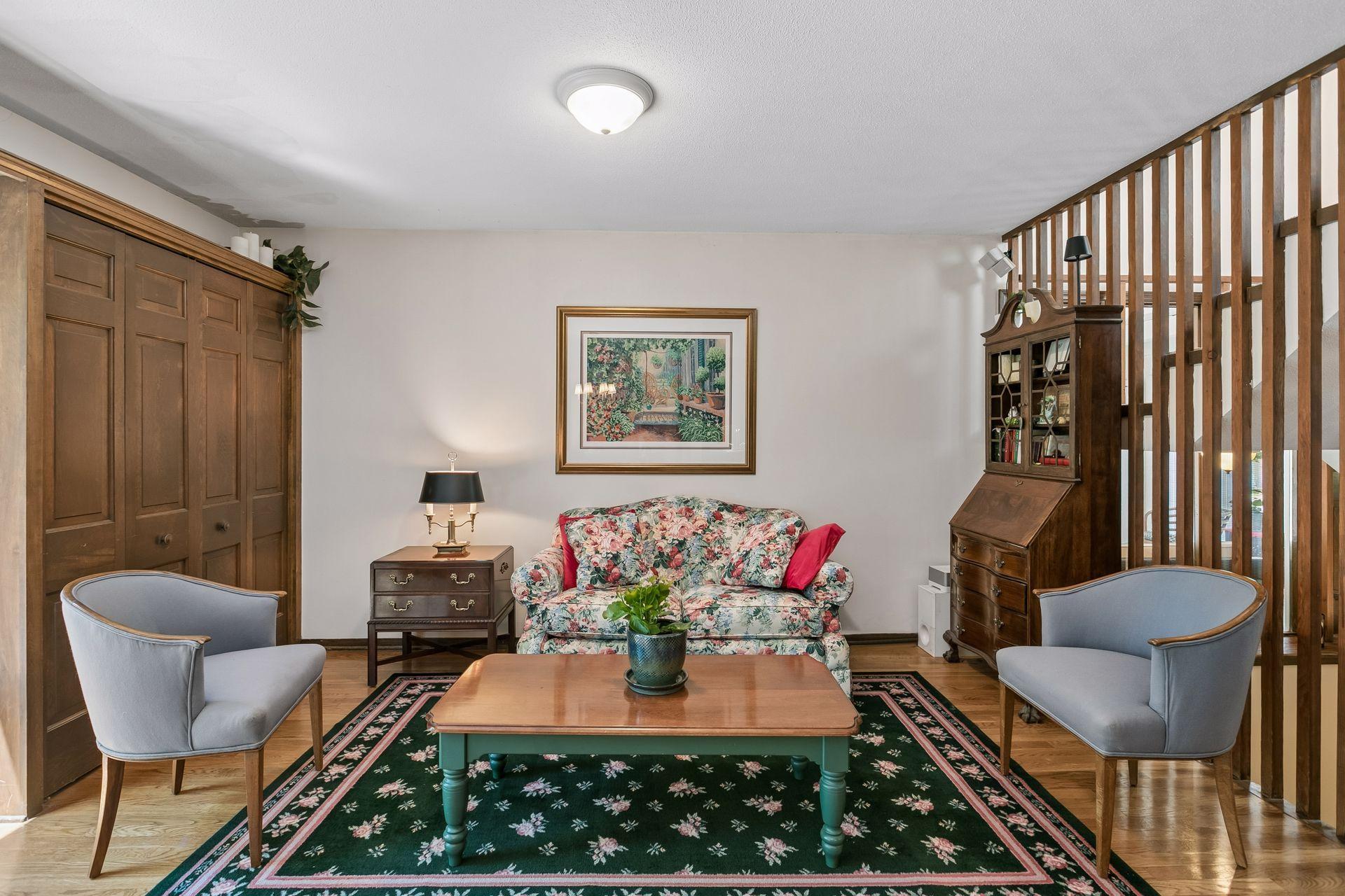Cozy family room space with gleaming hardwood flooring.