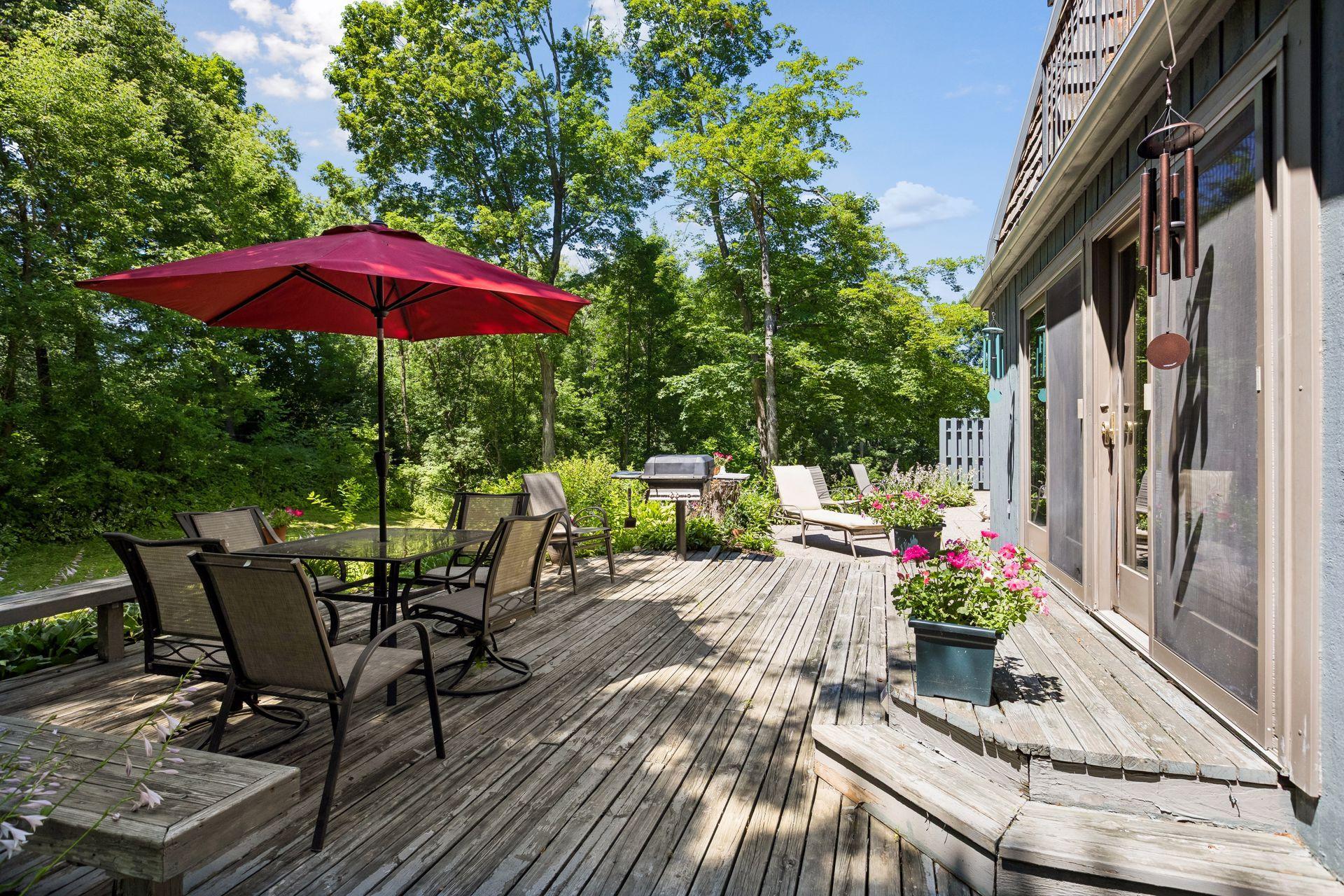Spacious deck and patio span the length of the house.
