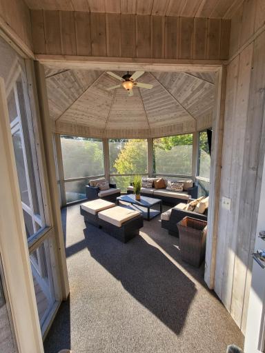 Octagonal screened porch overlooking the yard and pool area