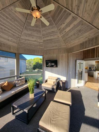 Large screened porch immediately adjacent to the kitchen