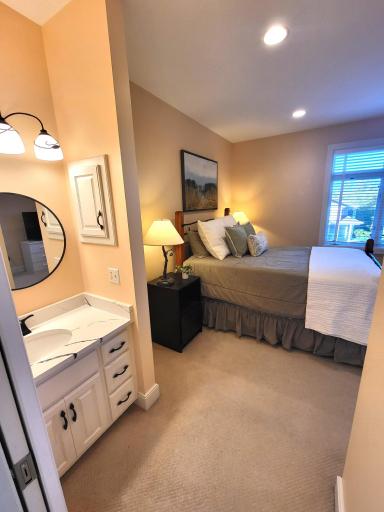 One of two jack-and-jill bedrooms with it own vanity area
