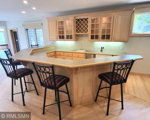 Wet bar with ice maker, refrigerator and lighted cabinets