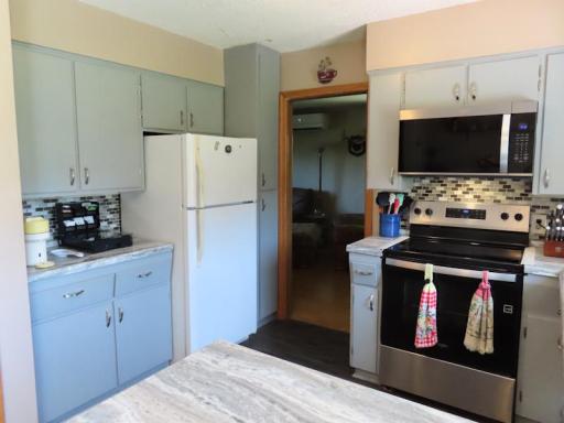 14920 kitchen stove fridge area.jpg