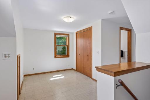 Upstairs loft leads to 1/2 bath and bedroom beyond
