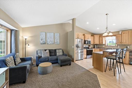 Open concept living room flows seamlessly into the kitchen and dining area.