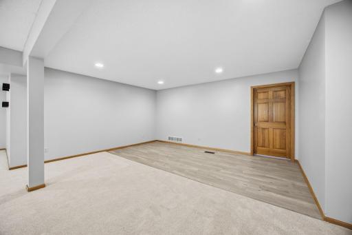 The door opens to a spacious unfinished area offering abundant storage space.