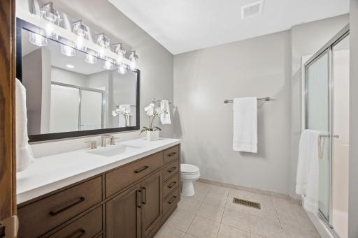 Large 3/4 bath with new vanity, mirror, and light.
