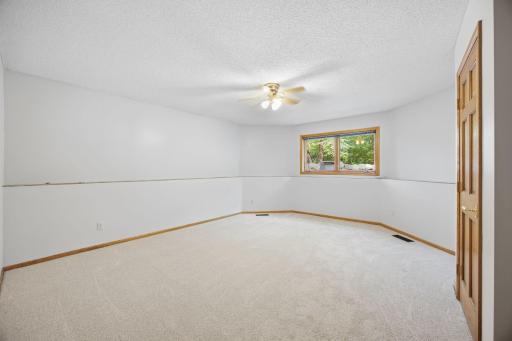 Very spacious bedroom with a storage area and walk in closet.