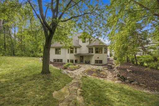 Private patio area and backyard. Door leads to lower-level living areas and to the kitchen located on main level.