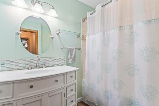 Full-size main floor bath has a jetted tub