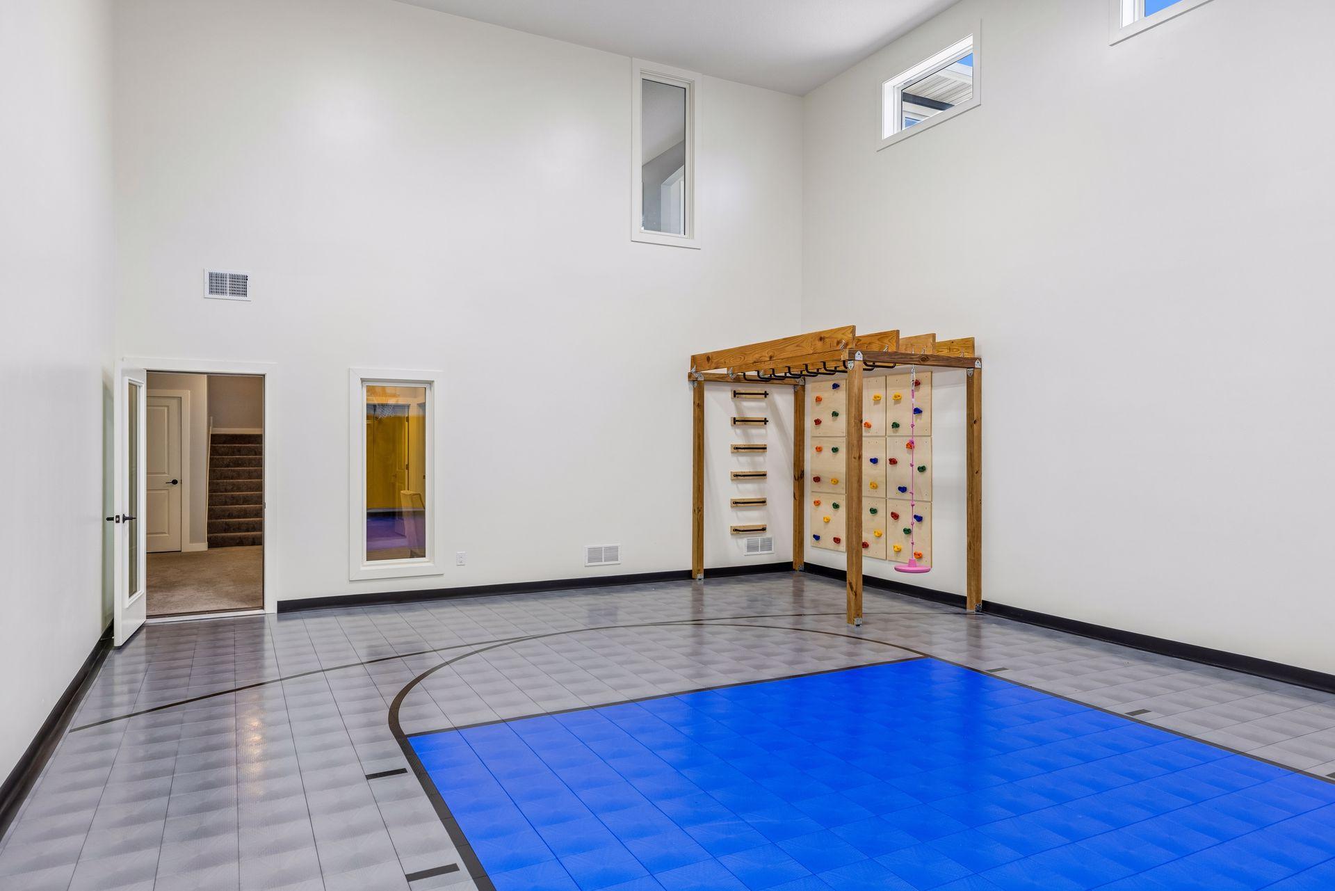 Jungle gym for all year entertainment! Can also be removed, and Seller has extra floor tiles for the sport court floor, if desired.