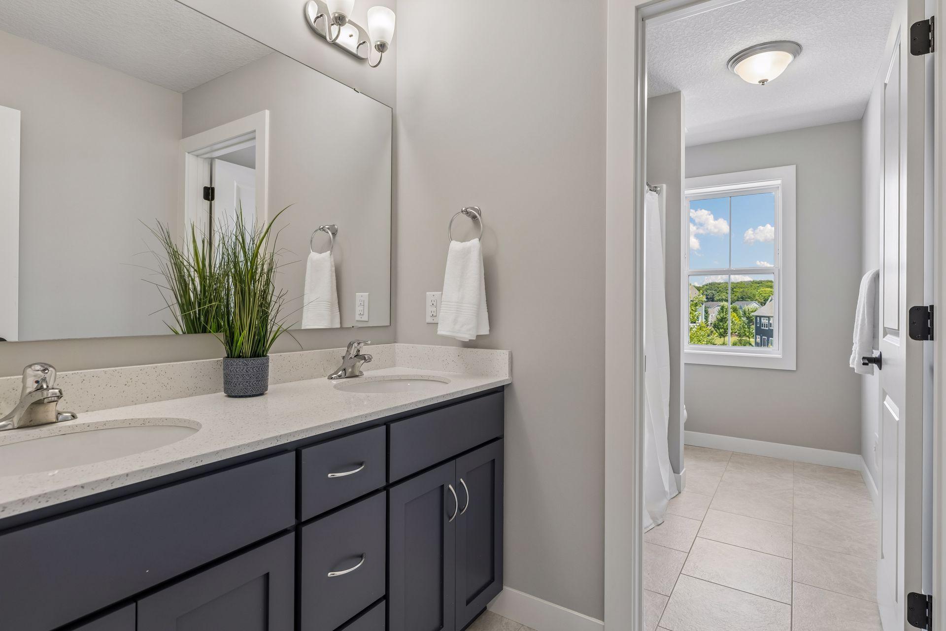 Upper level full bath with double sinks
