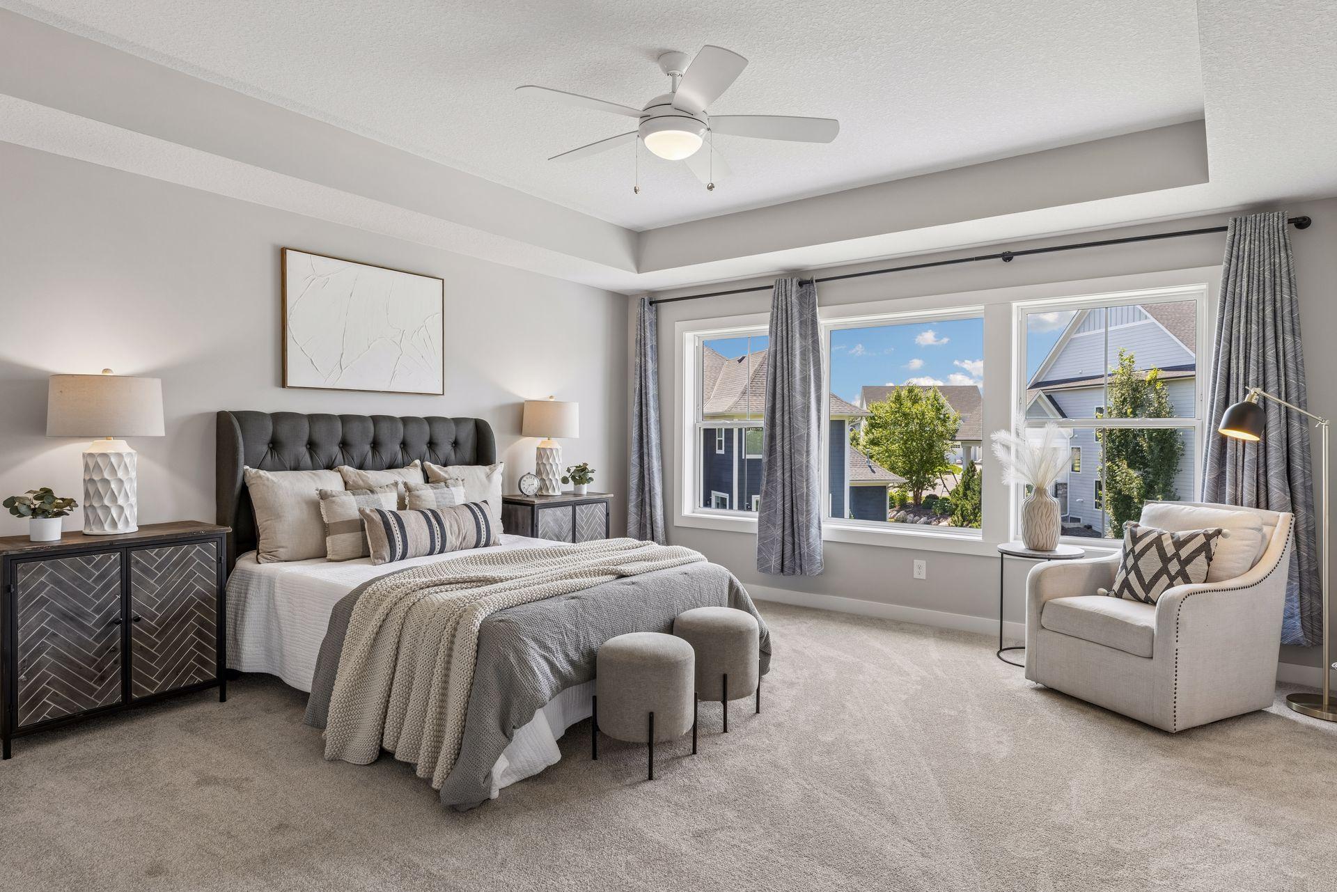 Upper level primary suite with large walk-in closet and ensuite bath
