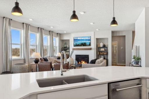 Sun soaked with natural light at your off-center dining area. Pictures are of model home - actual colors and finishes may vary.