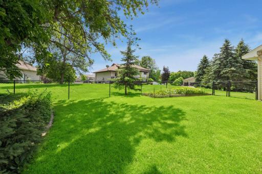 Seeking a garden? This yard offers so many spaces for fun, play, privacy or garden area.