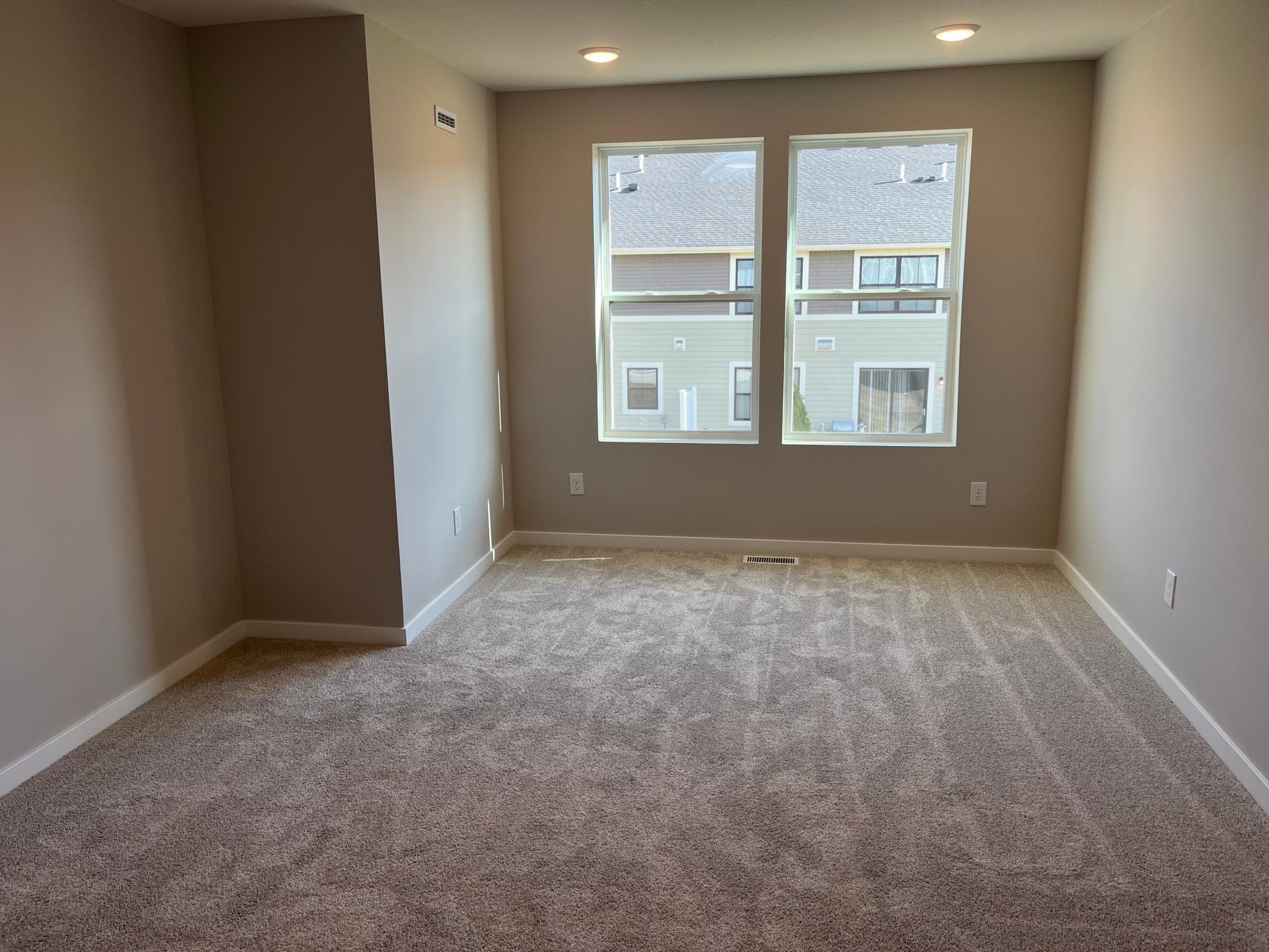 Primary bedroom with seating area