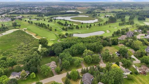 Rare golf course setting backing to the 11th hole at Rush Creek Golf Course. An exceptional opportunity to move in and enjoy the existing home or envision and build your dream home in a beautiful setting.