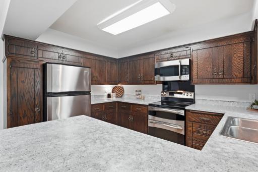 The kitchen features stainless steel appliances.