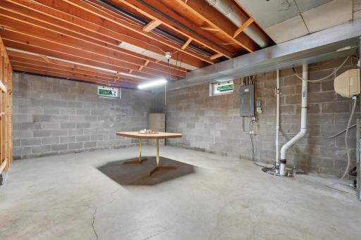 As you enter the lower level, to the right is the family room and to the left is a large unfinished area.