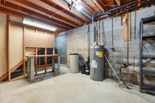 Lower level offers a nice workshop area and on the other side of the stairs, a great space for storage.