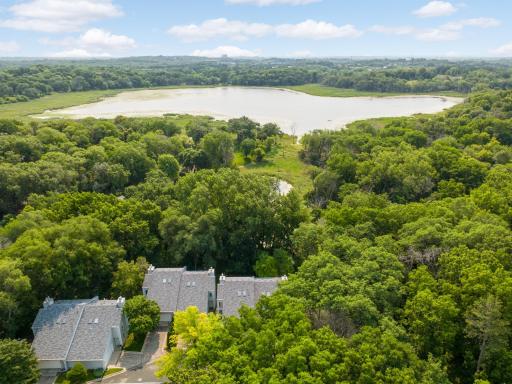 End-unit townhome surrounded by trees just north of Glen Lake