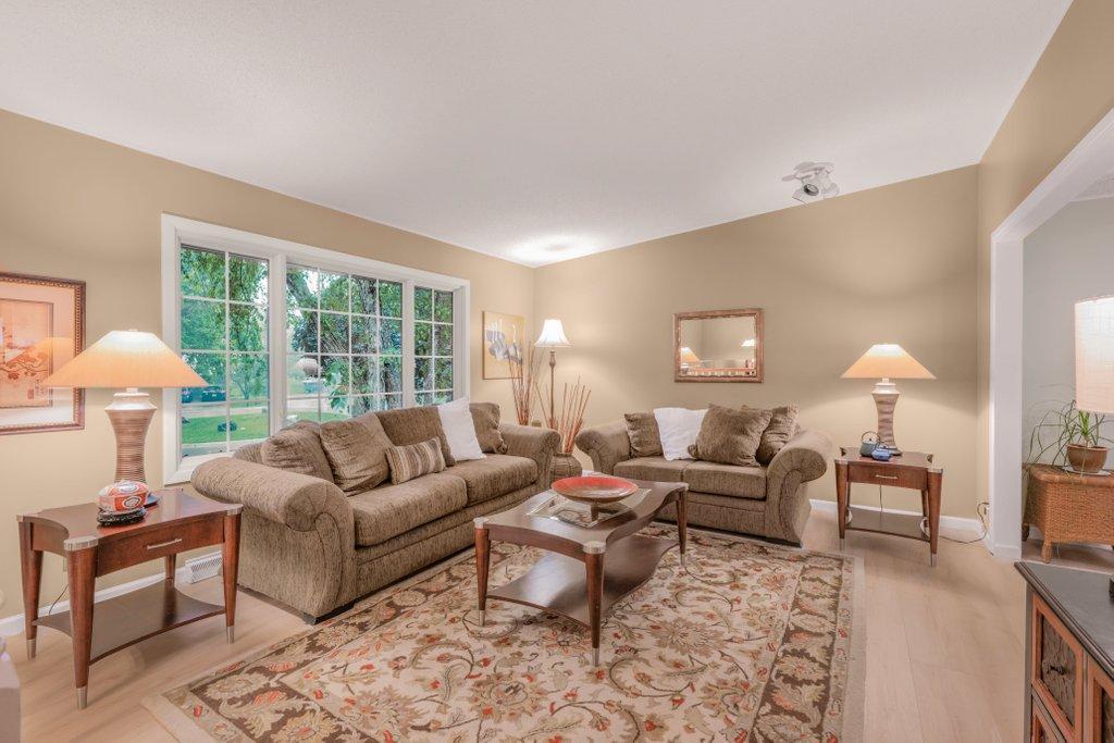 Main floor living room with lots of natural light.