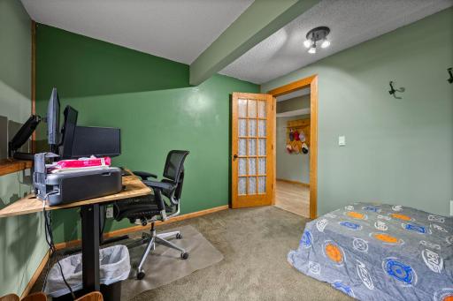 Flexible room currently used as a bedroom, ideal for a home office, guest room, or additional living space.