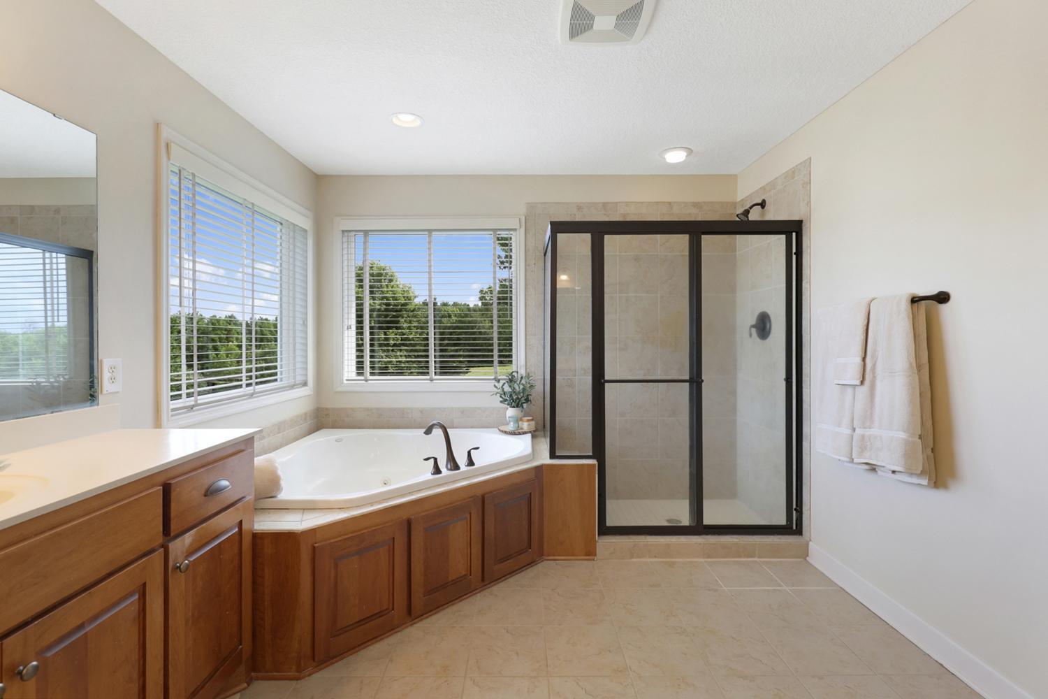 Cherry hardwood cabinets, large windows.