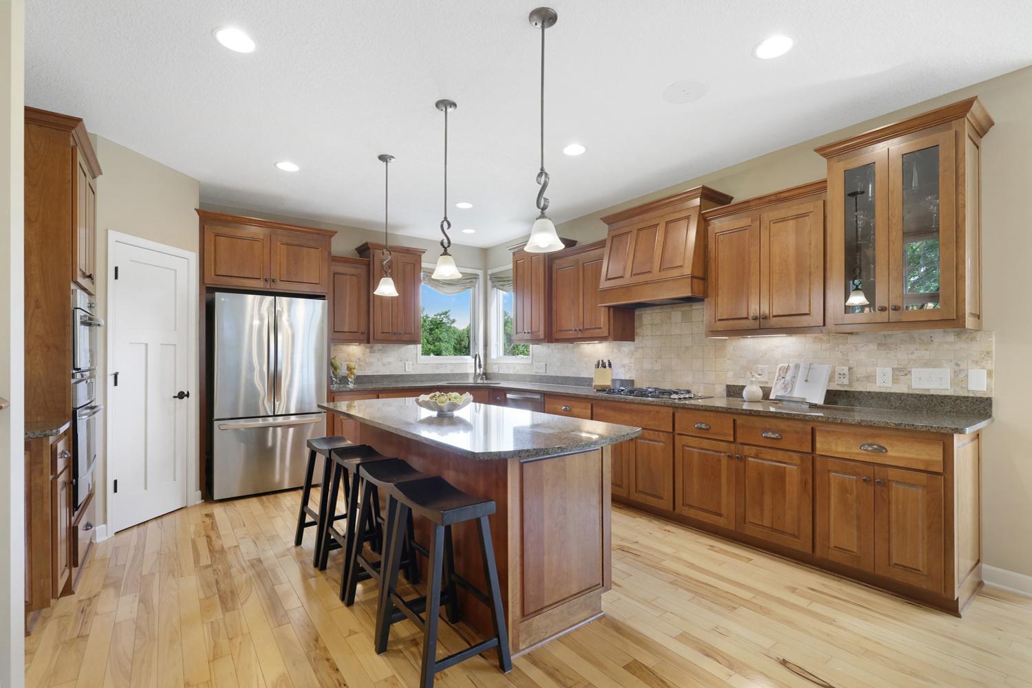 Timeless cherry hardwood cabinetry, granite countertops.
