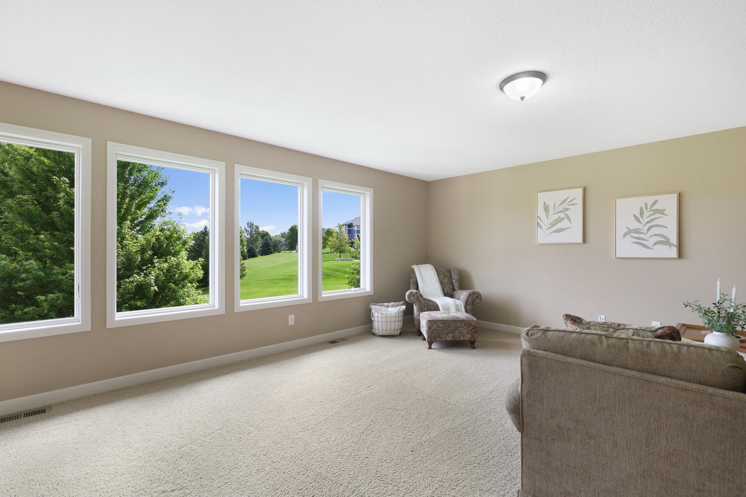 Spacious loft overlooking the backyard-ideal for a family room, media space, or playroom.