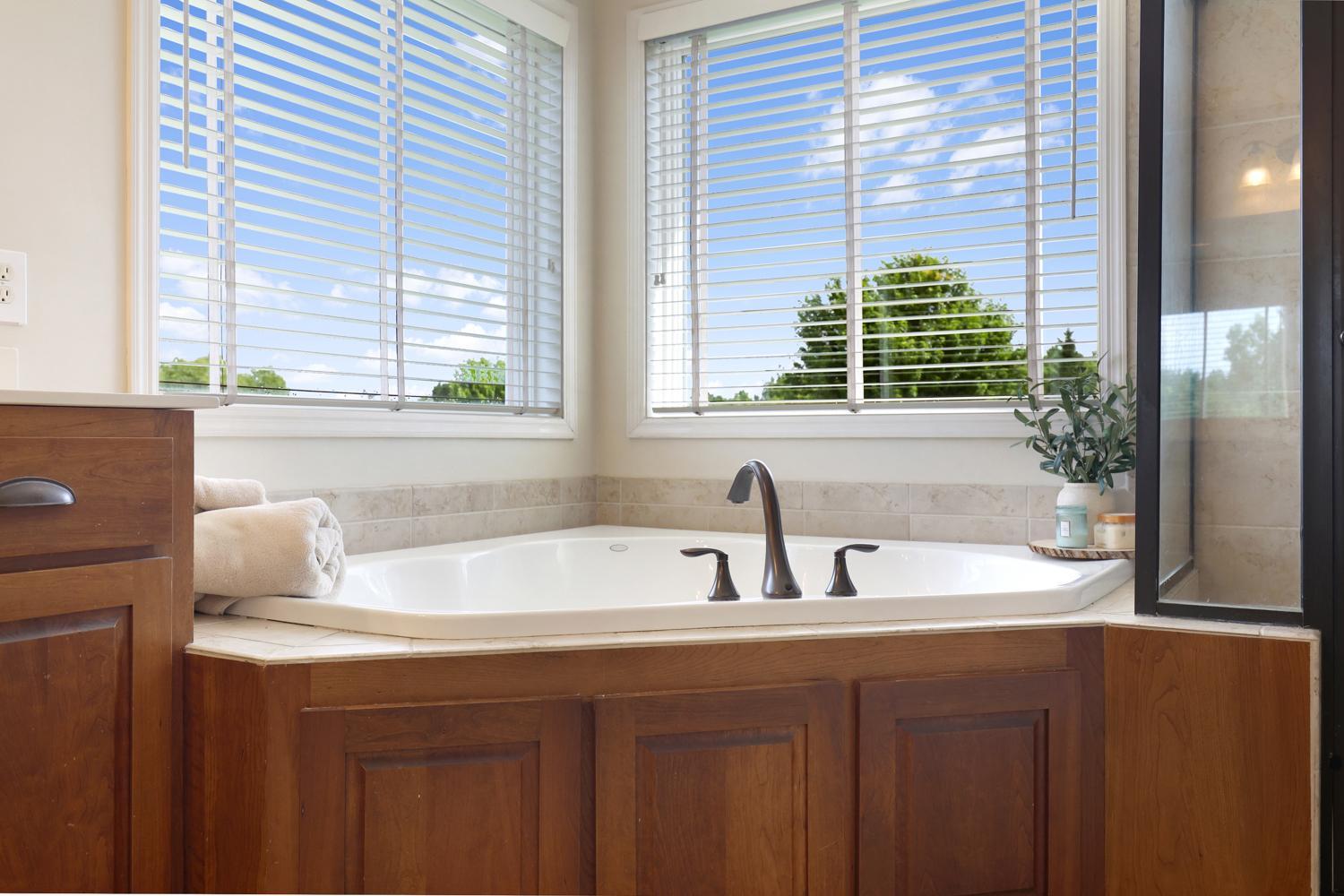 Large jetted tub in the primary bathroom.