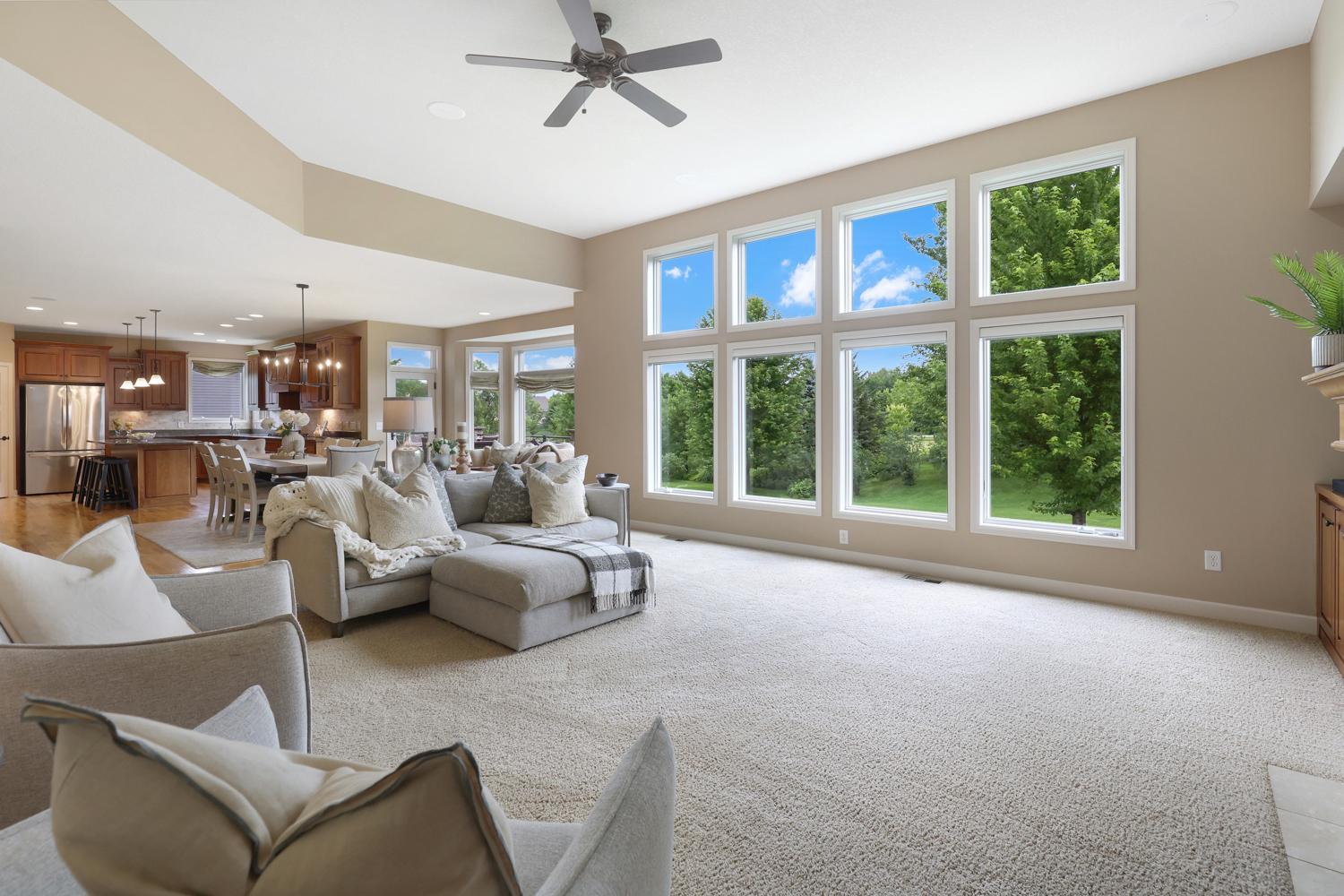 Designed for gathering, the open-concept family room is filled with natural light and flows effortlessly into the kitchen and informal dining space.
