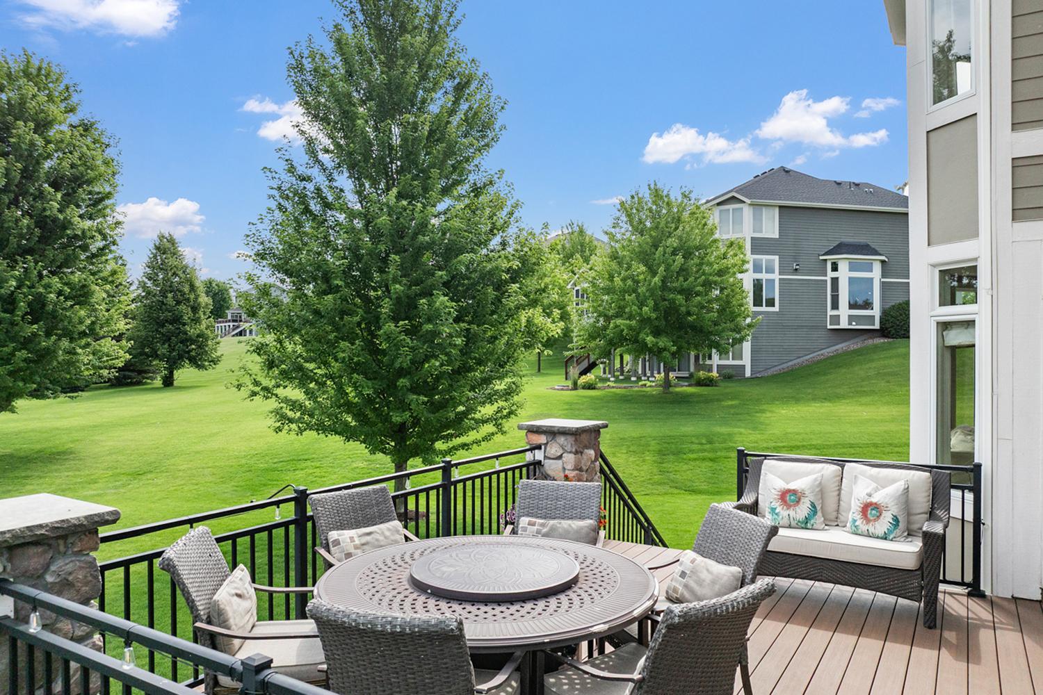Maintenance free deck overlooking the beautifully landscaped backyard.