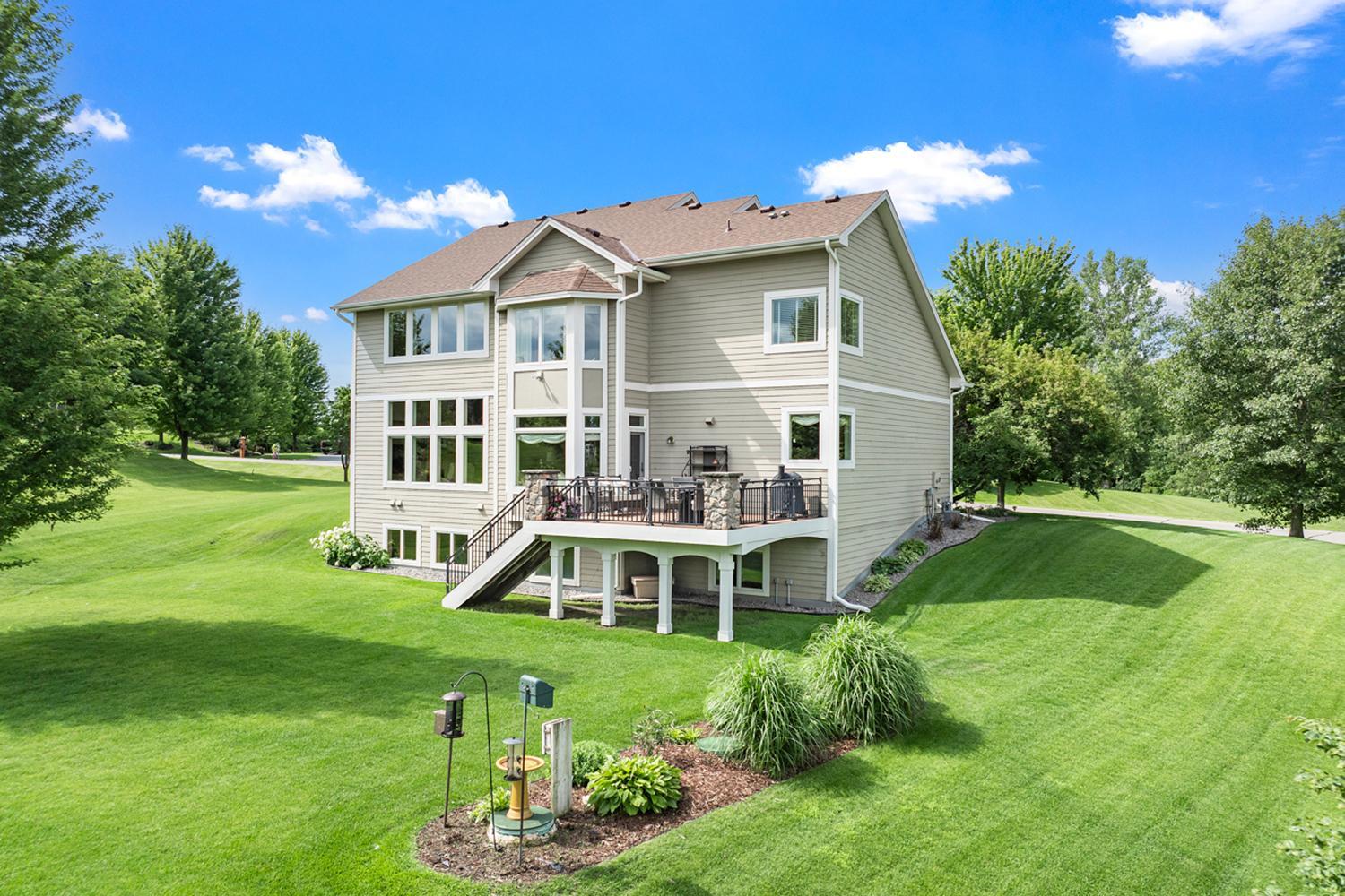 Enjoy exceptional outdoor living with a maintenance-free deck and a picturesque backyard.