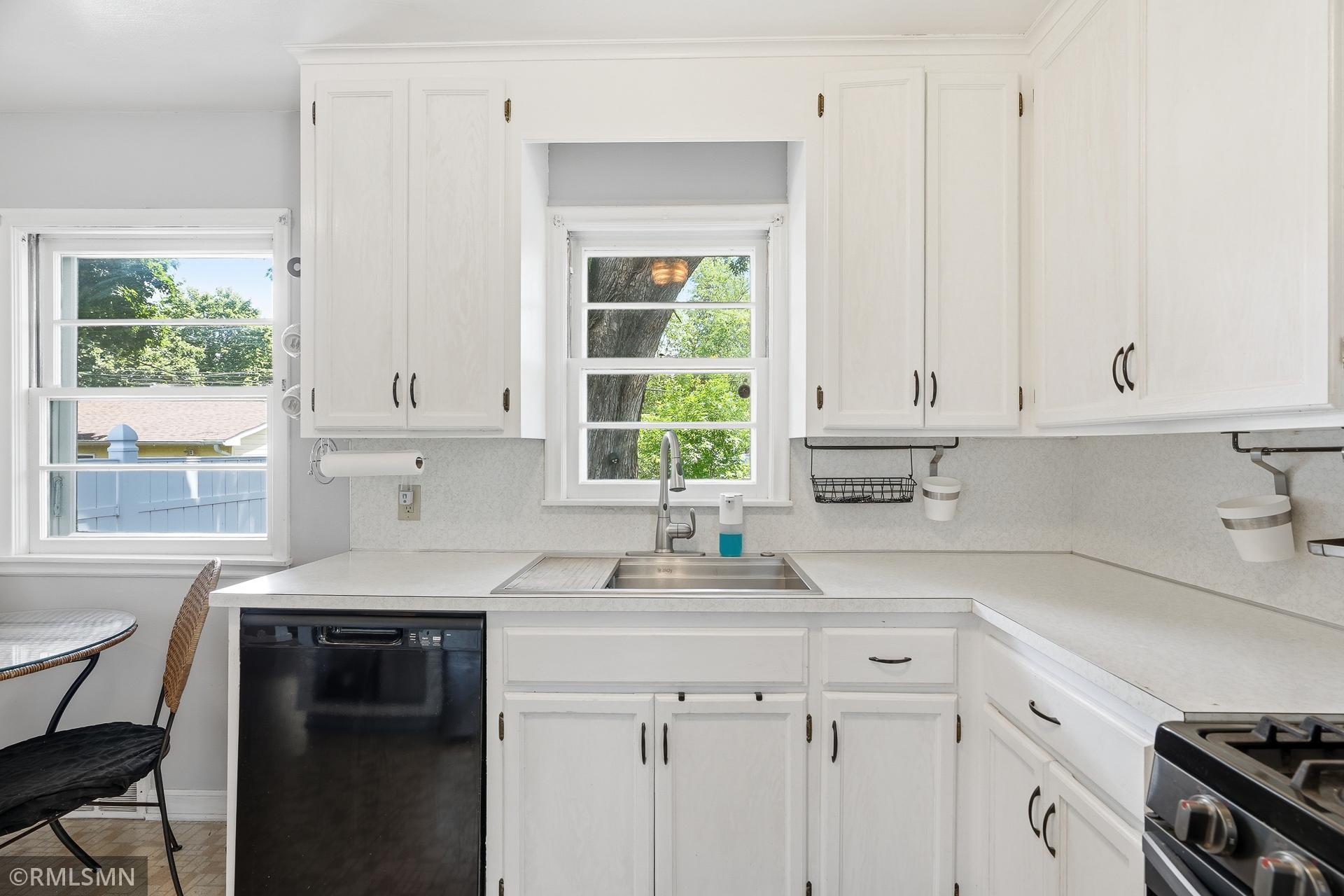 Dishwasher and towel bar conveniently placed
