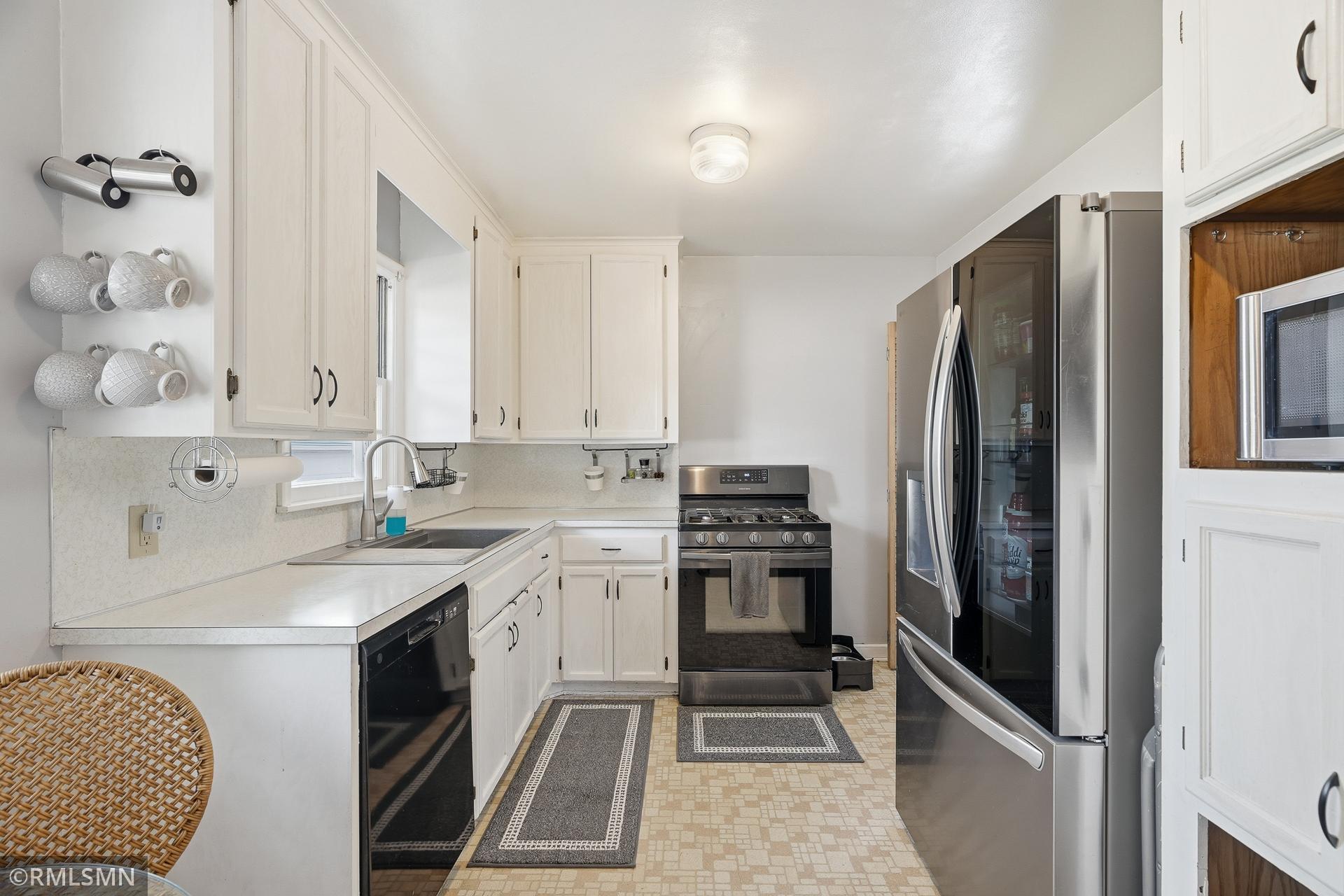 Newer appliances and a touch-free kitchen faucet for easy washing.