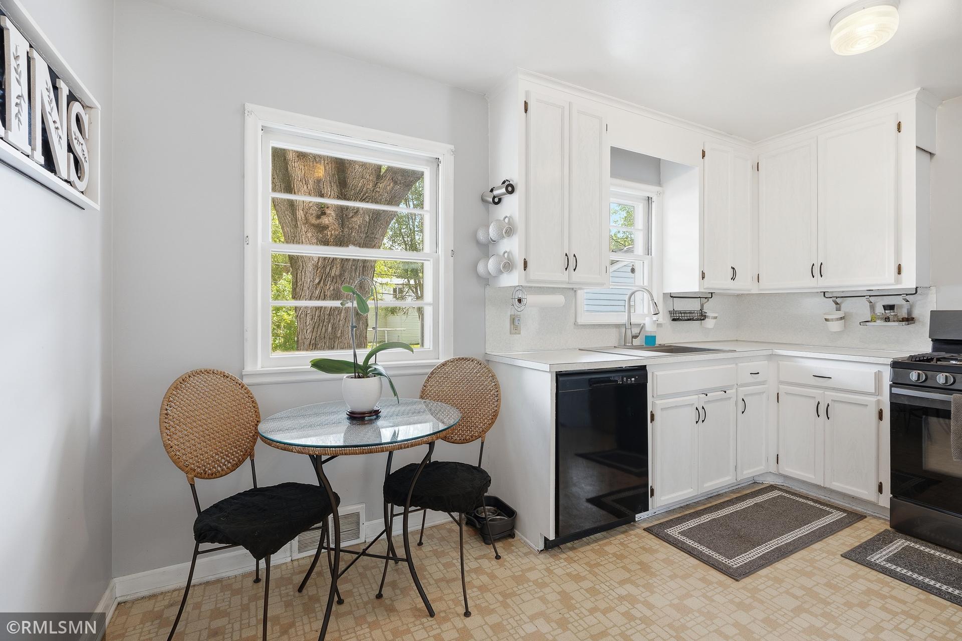 Cute kitchen and dinette area with windows overlooking the back yard.