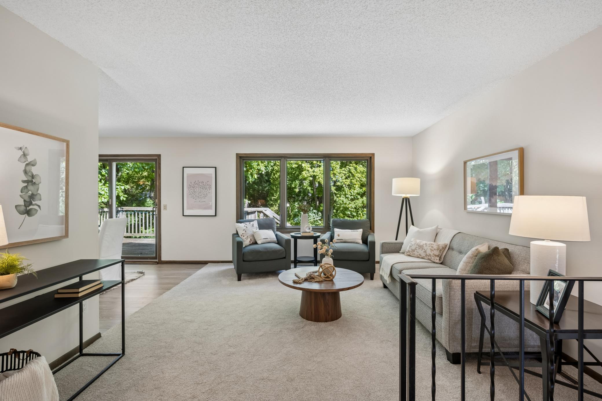 Bright and welcoming living room with a spacious feel and a warm, inviting atmosphere.