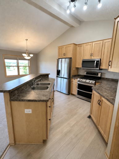 Newer stainless appliances and ceramic backsplash
