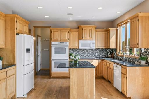 10577 Alamo Street Northeast - Beautiful Backsplash, Granite, Dual Oven. Notice the Garage entrance, easy access for bringing in groceries.