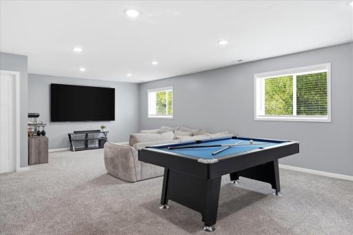 Finished lower level offers a generous recreation room with versatile use options