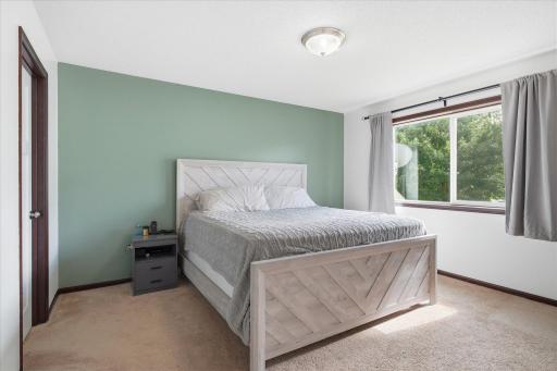 Spacious primary suite designed for comfort and privacy.